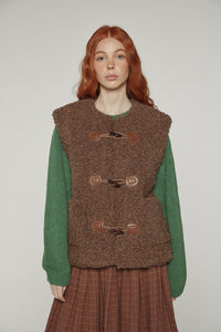 Reversible toggle button vest