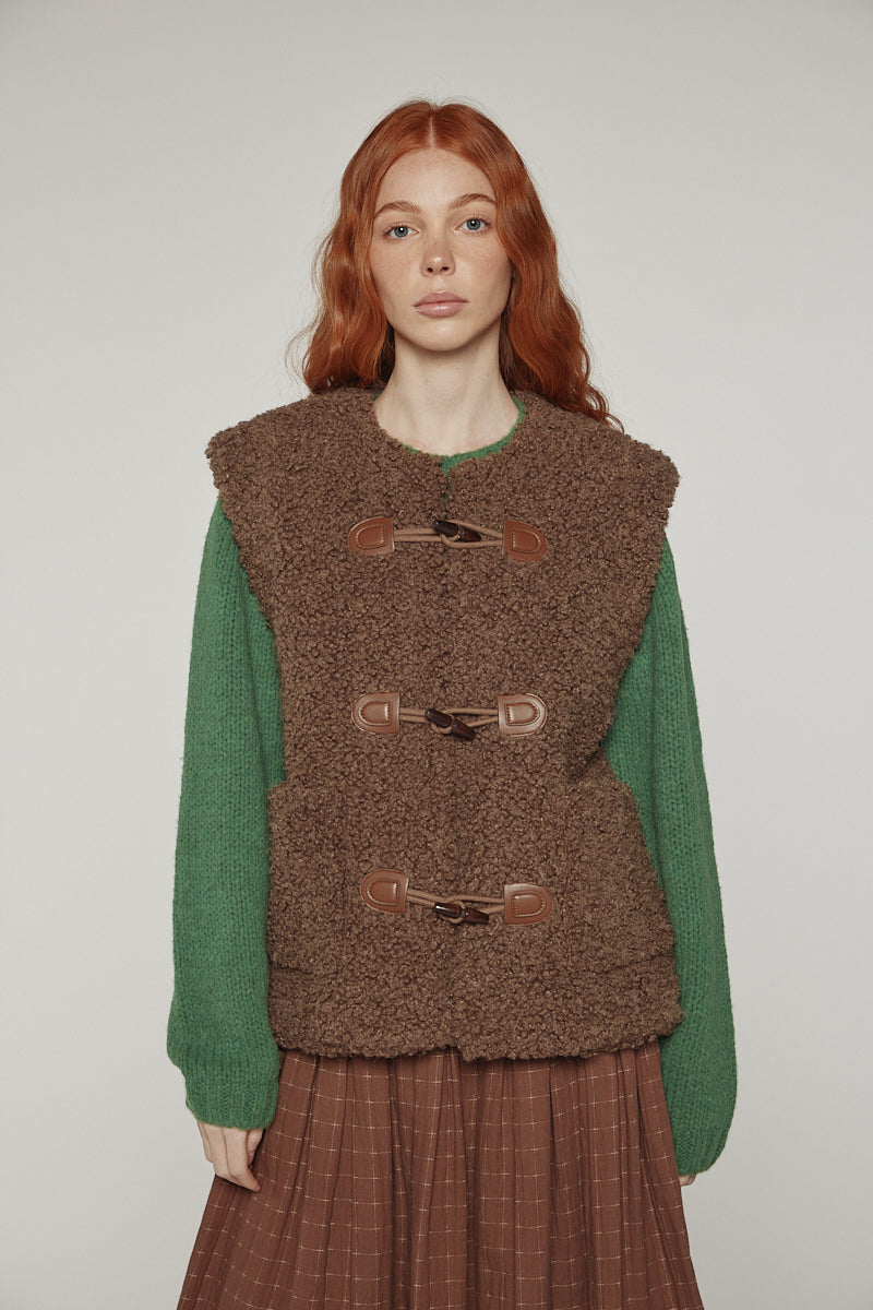 Reversible toggle button vest