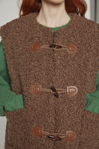 Reversible toggle button vest